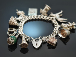 London around 1975! Beautiful charm bracelet with twelve...