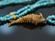Around 1970! Filigree fish pendant with long turquoise chain gold-plated silver
