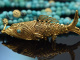 Around 1970! Filigree fish pendant with long turquoise chain, gold-plated silver