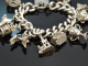 Birmingham 1973! Schweres englisches Bettelarmband mit 10 Charms und Herzschlie&szlig;e aus Silber 925