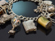 Birmingham 1972! Lavish charm bracelet with 14 charms and heart clasp made of 925 silver
