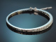 Circa 1950! An elegant bangle set with ca. 3.2 ct Old European Cut diamonds, in 750 white gold