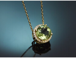 Delicate peridot and diamond pendant with a 585 gold chain