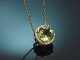 Delicate peridot and diamond pendant with a 585 gold chain