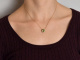 Delicate peridot and diamond pendant with a 585 gold chain