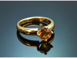 A simple, understated ring featuring a delicate citrine,...
