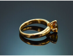 A simple, understated ring featuring a delicate citrine,...