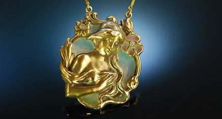 Antique Art Nouveau pendant featuring a female motif and colourful window enamel